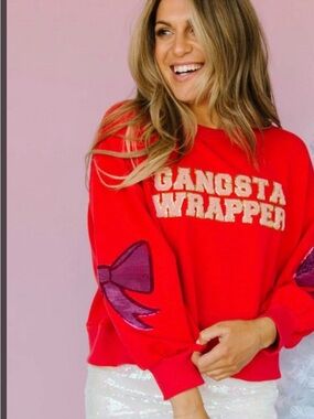 Red Crewneck Sweater with 'Gangsta Wrapper' Graphic and Purple Bow Sleeves